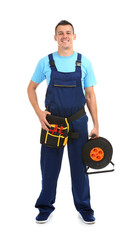 Electrician with extension cord reel and tools on white background