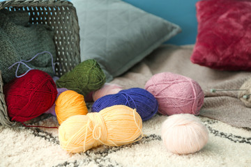Fototapeta na wymiar Colorful knitting yarn on floor in room