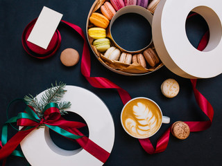 Macaroon present box for Christmas with cappuccino