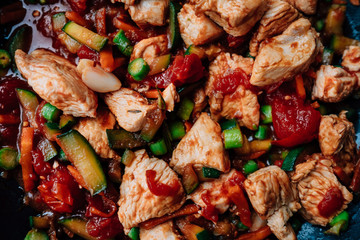Pork Goulash with a lot of vegetables like tomatoes, asparagus, Capsicum annuum , Zucchini and...