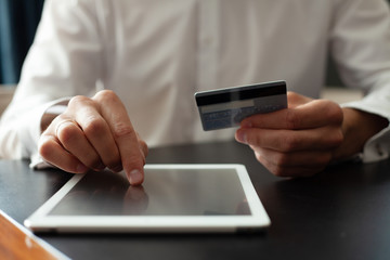 Man using Tablet pc. Credit card, Shopping online.