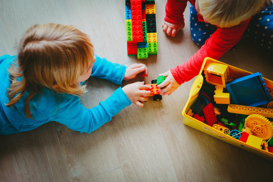 kids play with plastic blocks, learning concept