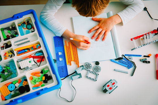child building robot at robotic technology school lesson