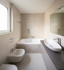 Modern bathroom with large marble tiles
