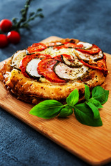 Pie Tomato Zucchini Mozzarella, pesto and virgin olive oil