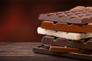 Delicious chocolates isolated on  background