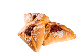 baked triangular cakes with sweet stuffing inside, strawberries, currants, close-up, white background