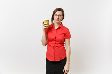 Portrait of tired young business teacher woman in red shirt glasses holding cup of coffee or tea in hands isolated on white background. Education or teaching in high school university fatigue concept.