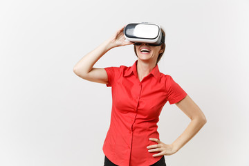 Portrait of young smart business woman in red shirt, black skirt in headset of virtual reality on head isolated on white background. Education or teaching of future in high school university concept.