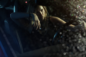 woman in car night light