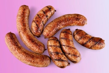 Roasted sausages on white background