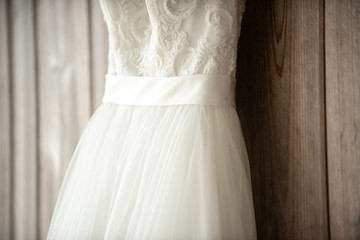 Fototapeta na wymiar White lace wedding dress close up