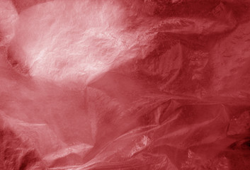 Fototapeta premium Plastic transparent old wrap texture in red