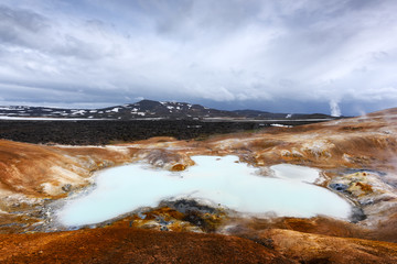 Acid hot lake in the geothermal valley Leirhnjukur, near Krafla volcano, Iceland, Europe.