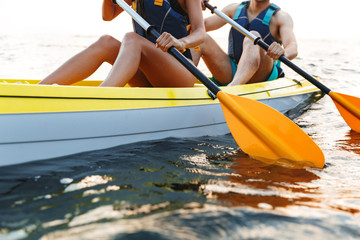 Cropped image of a couple kayaking on lake