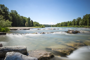 Obraz premium Longtime Exposure of River with River Steps and River Bank in Munich, Bavaria, Germany, Europe