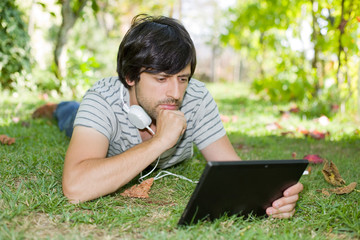 man relaxing with tablet pc