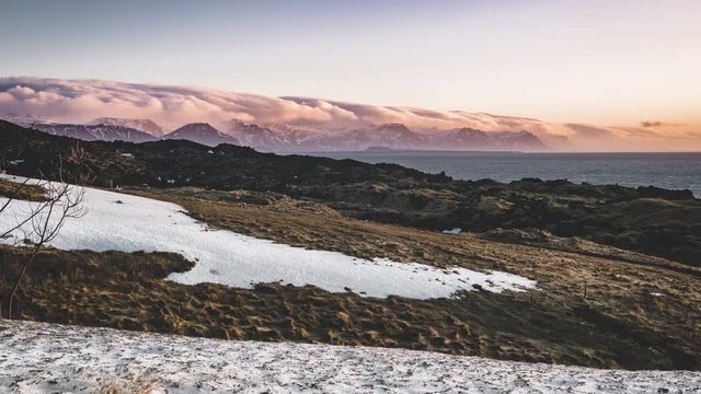 4K Time lapse film video movie of Icelandic sunrise sunset mountain landscape at Arnarstapi area in Snaefellsnes peninsula in Iceland