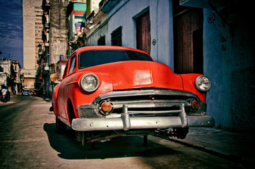 old american car of the 50s parked for repairs on a street in Havana