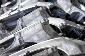 Pile of aluminum automotive parts arm rear, casting process in the automotive factory