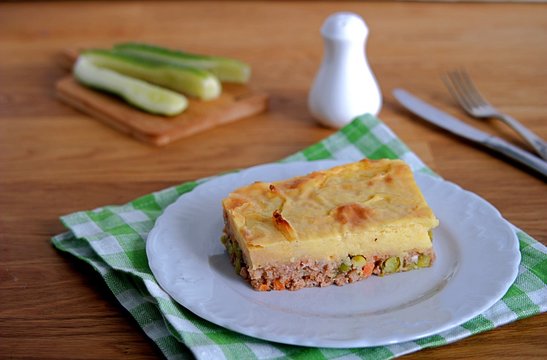 Portion of shepherd's pie, a traditional British casserole with mashed potatoes, meat and vegetables.