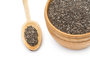 Wooden bowl and spoon with chia seeds seen from above and isolated on white background