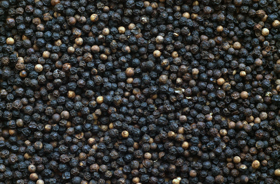 Fototapeta Black pepper close-up with blur effect.