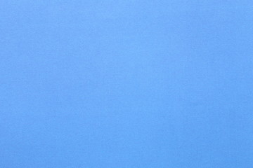 surface of blue art paper background.