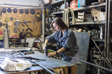 young woman working in a workshop