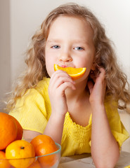 Child with oranges