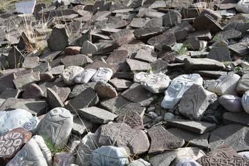 Tibet. Buddhist prayer stones with mantras and ritual drawings on the trail from the town of...