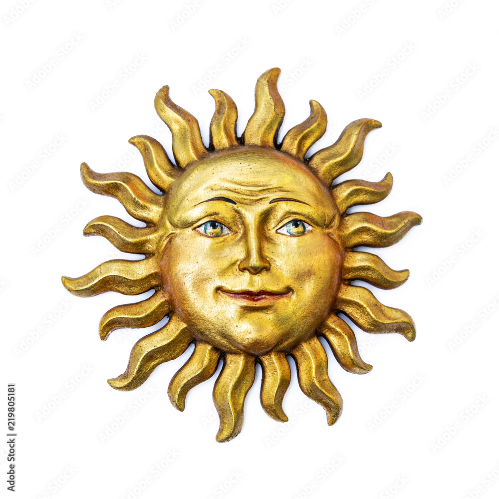 Wall mural Golden sun face symbol with sunrays isolated on white. Wooden decor ornament symbol painted on gold paint. Summer weather and heat sign