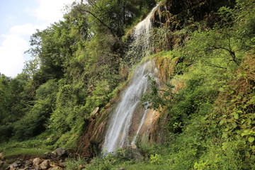 Fototapeta na wymiar Stunning Waterfall In Remote Village of Bagh, Azad Jammu and Kashmir