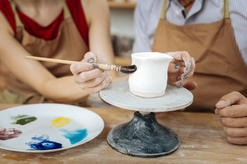 Weekend in workshop. Couple of artists feeling relaxed while spending their weekend in workshop together