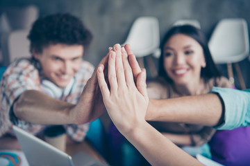 Close-up cropped photo of four people, friends' palms putting together, successful unity, company...