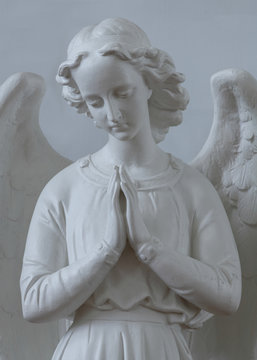 Angel sculpture inside historic Saint Peter's Catholic Church in Cheticamp, Nova Scotia