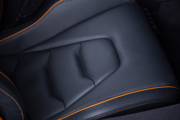 British sports car seat with orange stitching