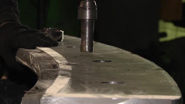 Countersink, is used for machining and chamfering holes in holes. Machining of parts. Countersinking on a vertically-drilled CNC machine.