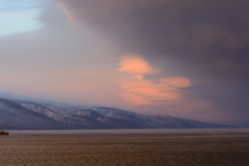 vortex clouds at sunset on the lake Baikal