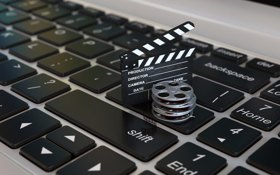 Laptop with films reel and movie clapper, Video editing or online movie internet concept 3d rendering