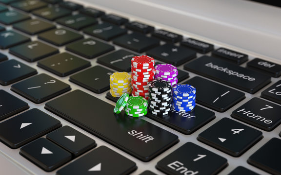 Online gambling 3d concept, poker chips on laptop keyboard, 3d rendering