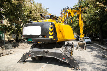 Excavator, hydraulics, tires, screws