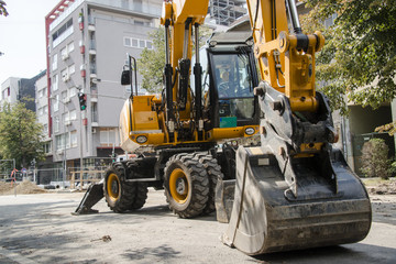 Excavator, hydraulics, tires, screws