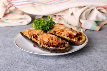 Half baked eggplants stuffed with vegetables and beans