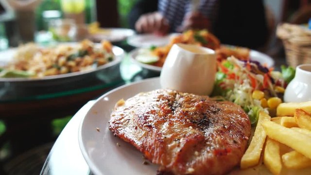 Lunch is chicken steak with window light at noon