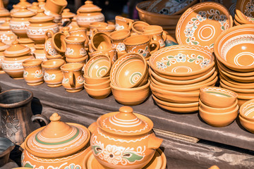 Clay dishes. Crockery made clay. Dishes background