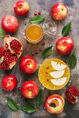 The Jewish New Year. Red apples, pomegranate and honey. Rosh Hashana. Top view, overhead, flat lay.