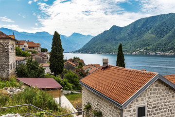 Fototapeta na wymiar The beautiful village of Perast in Montenegro. Perast sits on the bay of Kotor on the Adriatic sea and lies a few miles north of Kotor.