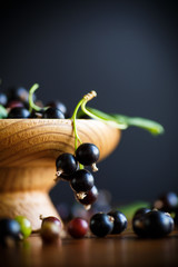 ripe berries black currants on a wooden table