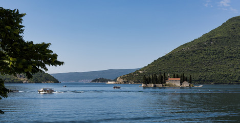 Fototapeta na wymiar The island of St George viewed from the lovely village of Perast in Montenegro 